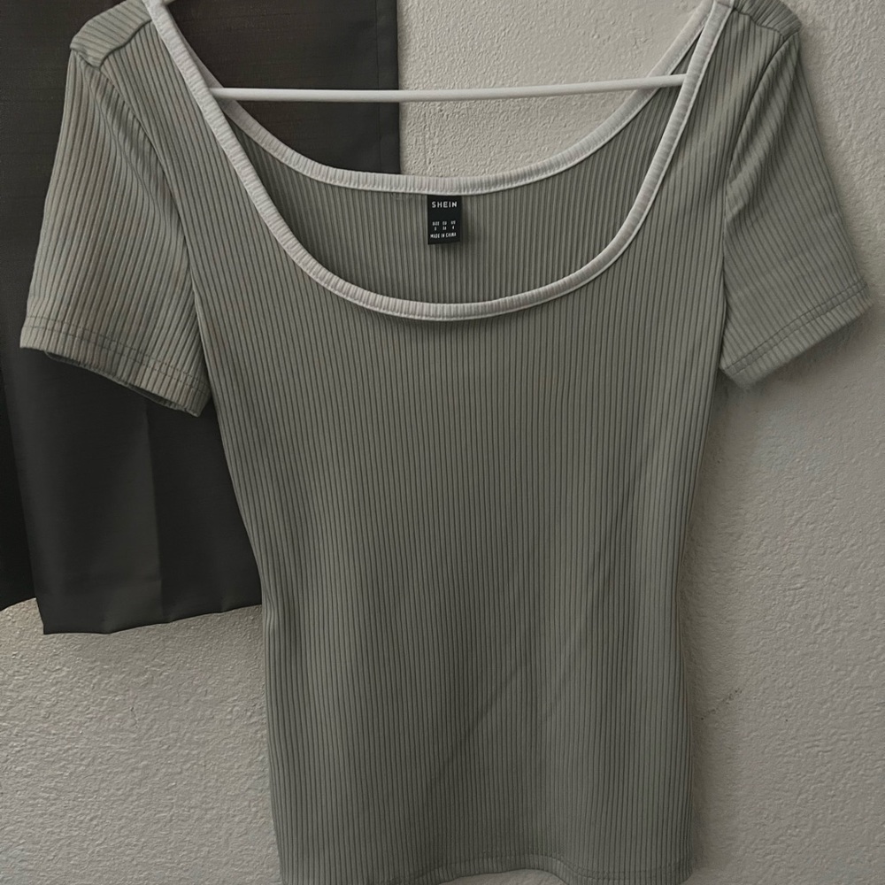 This is a line green shirt that is new never worn!! before from the brand shein.